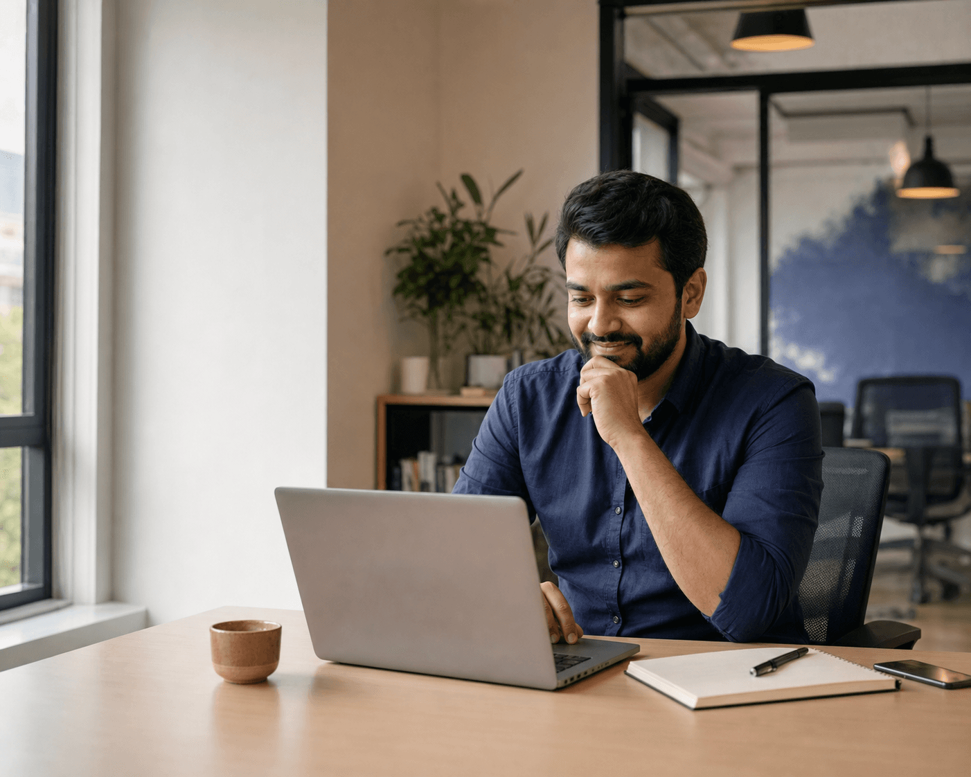 A recruiter reviewing candidates on a laptop
